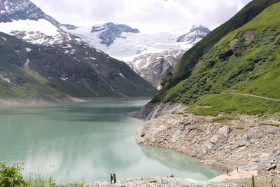 Scenic view of mountains and lake against sky