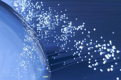 Close-up of blue fiber optic and crystal ball