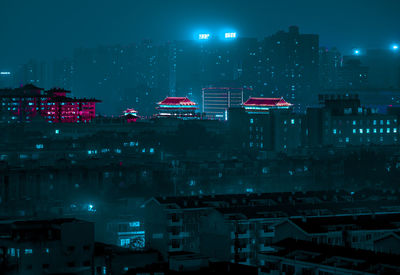 Aerial view of illuminated city at night