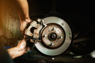 Low angle view of man working in machine