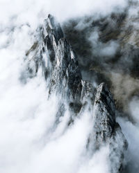 Scenic view of clouds over mountain