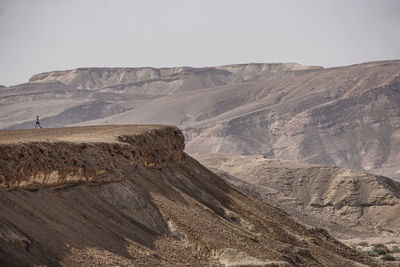 Woman standing on mountain