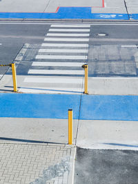 High angle view of road sign on street