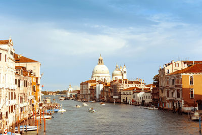 Grand canal by santa maria della salute against sky