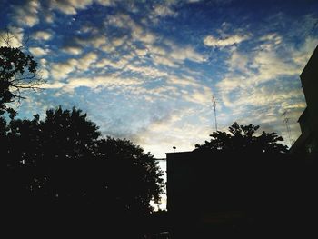 Silhouette trees against sky during sunset