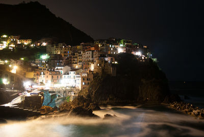 Houses on coast at night