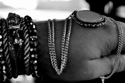 Close-up of mid adult hand with jewelry 