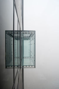 Glass balcony at a skyscraper on a foggy day