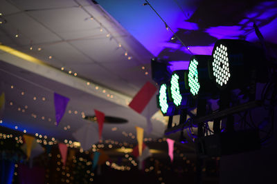 Low angle view of illuminated ceiling