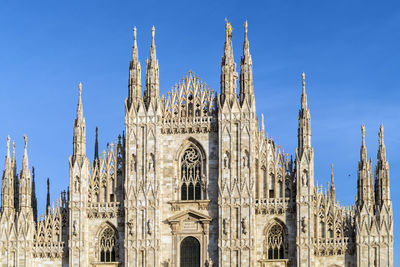 Panoramic view of temple building against blue sky