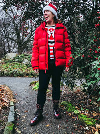 Portrait of young woman standing in snow