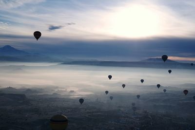 Hot air balloons flying at cappadocia during sunset