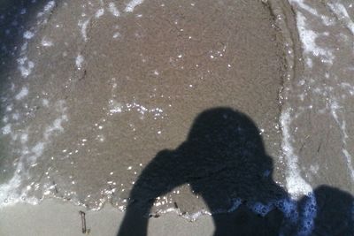 Low section of people standing in puddle