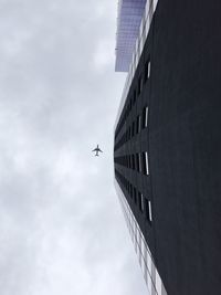 Low angle view of airplane flying in sky