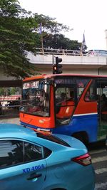 View of car on street against city