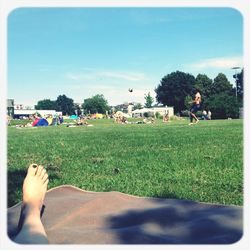 People relaxing on field