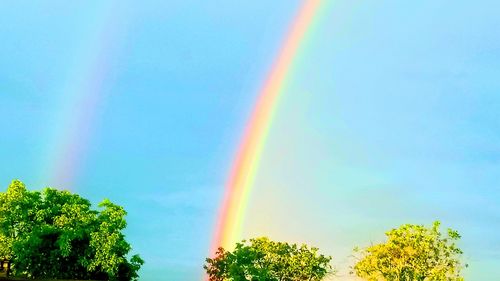 Low angle view of rainbow against sky