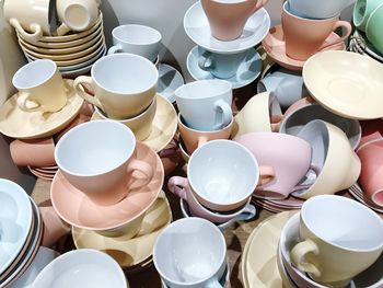 High angle view of tea cups and saucer displayed for sale