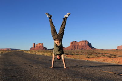 Full length of woman standing on landscape