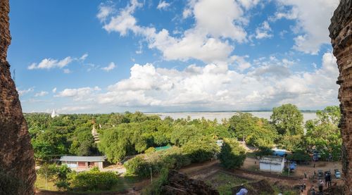 Panoramic view of trees and sea against sky