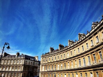 Low angle view of buildings against blue sky