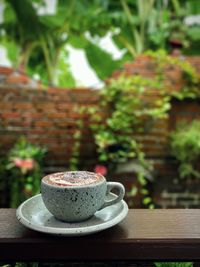 Close-up of coffee cup on table