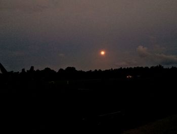 Scenic view of silhouette landscape against sky at night