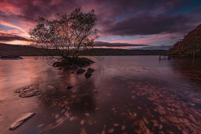 Scenic view of lake against sky during sunset