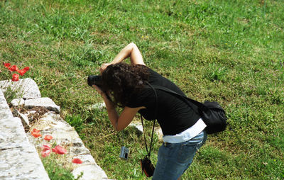 Side view of woman on field