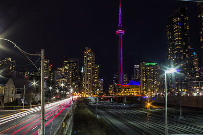 Cn tower against sky in illuminated city at night