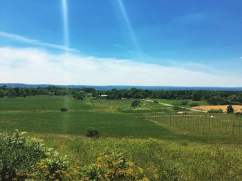 Scenic view of landscape against cloudy sky