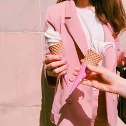 Friends holding ice cream cone