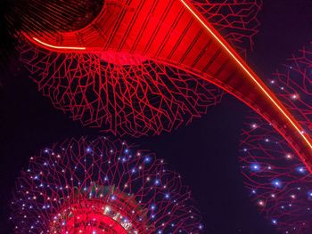 Low angle view of illuminated lights at night