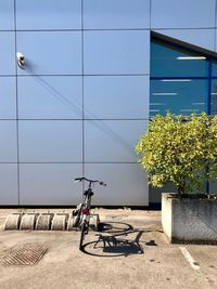 Bicycle on wall against building