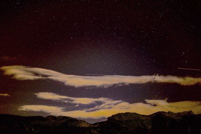 Low angle view of mountain against sky at night