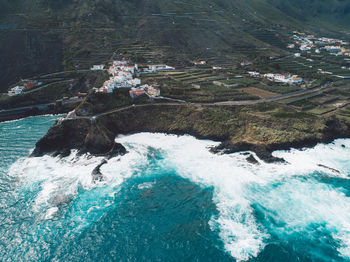 High angle view of water flowing through rocks