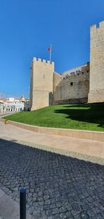 View of old building against blue sky