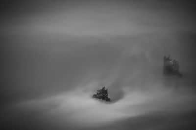 Lone boat in sea against sky