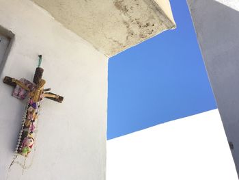 Low angle view of buildings against blue sky