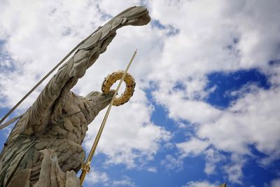 Low angle view of statue against sky