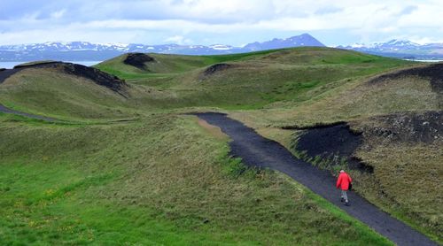 Scenic view of landscape and mountains against sky