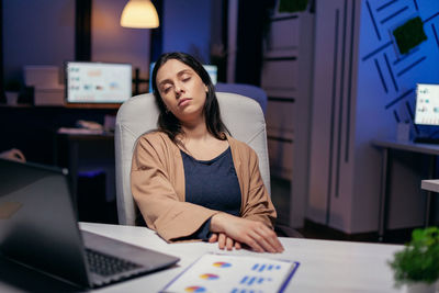 Overworked businesswoman resting at office