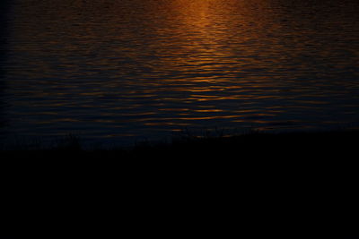 Scenic view of silhouette landscape against sky at sunset