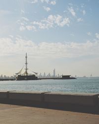 Sailboats in sea against sky