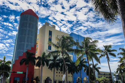 Low angle view of building against cloudy sky