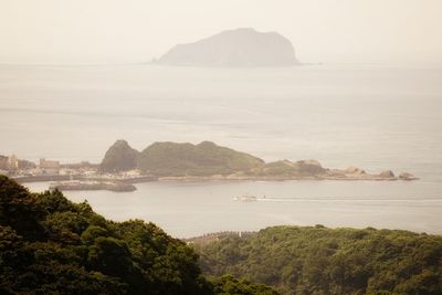 Scenic view of bay against sky