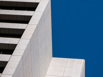 Low angle view of building against clear blue sky