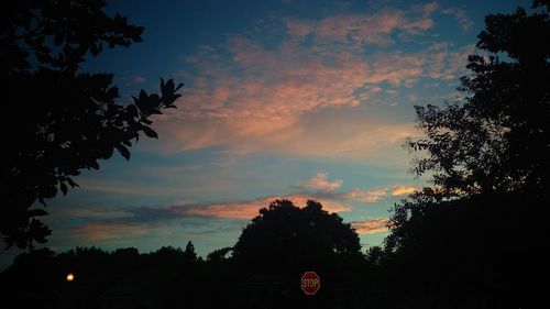 Silhouette of trees against sky at sunset