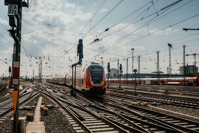 Train on railroad track against sky