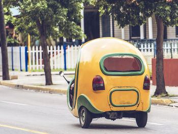 Yellow car on street